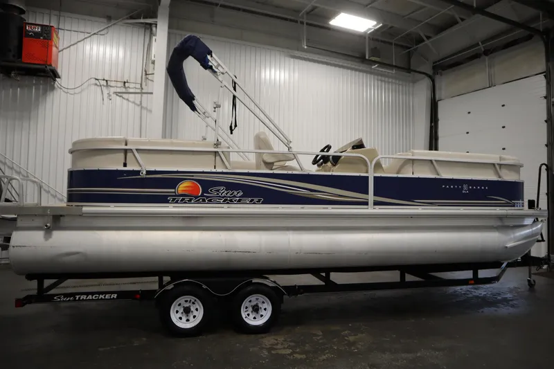 Slide: The Image of 2014 Sun Tracker Party Barge 24 DLX pontoon boat in indoor storage. - 3