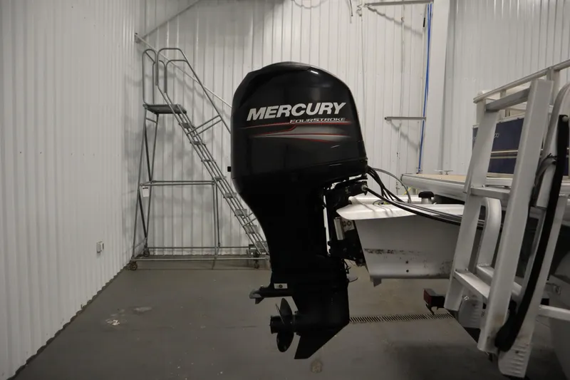 Slide: The Image of 2014 Sun Tracker Party Barge 24 DLX with Mercury outboard motor in storage. - 31