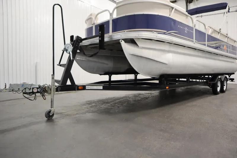 Slide: The Image of 2014 Sun Tracker Party Barge 24 DLX pontoon boat on trailer in indoor storage. - 37