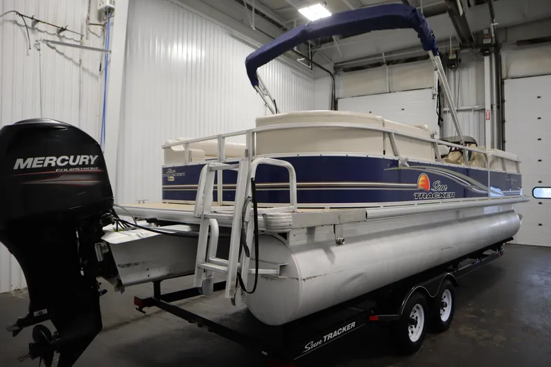 Slide: The Image of 2014 Sun Tracker Party Barge 24 DLX pontoon boat with Mercury engine in indoor storage. - 4