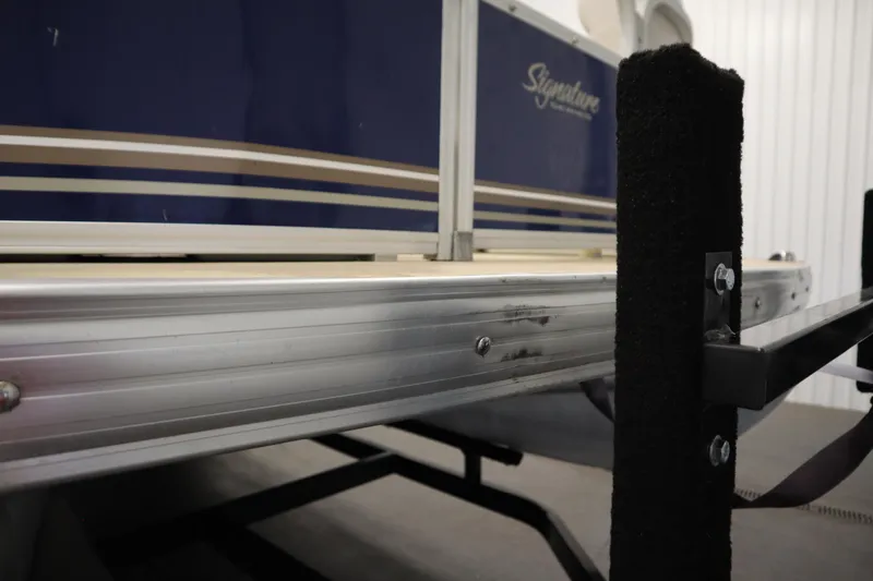 Slide: The Image of 2014 Sun Tracker Party Barge 24 DLX pontoon boat on trailer, close-up view. - 41