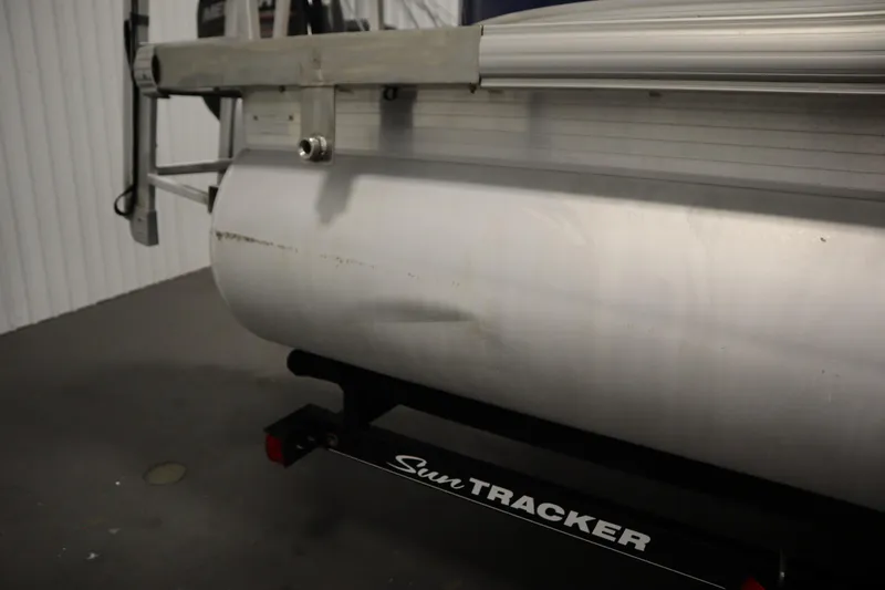 Slide: The Image of 2014 Sun Tracker Party Barge 24 DLX pontoon with visible dent on the side. - 42