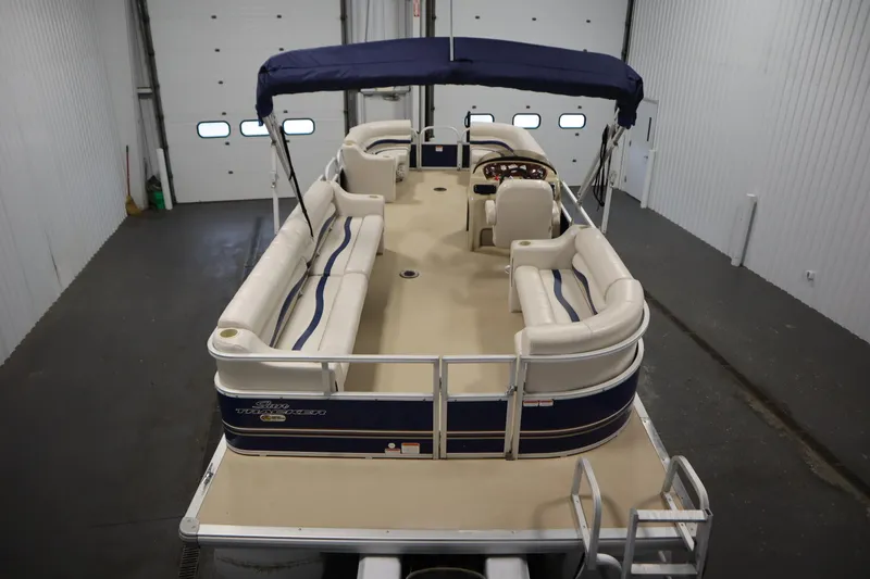 Slide: The Image of 2014 Sun Tracker Party Barge 24 DLX pontoon boat in indoor storage. - 9