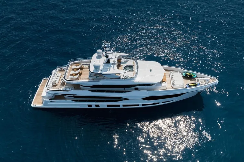 Slide: The Image of Luxurious 2023 Majesty 120 yacht cruising on open blue sea. - 1