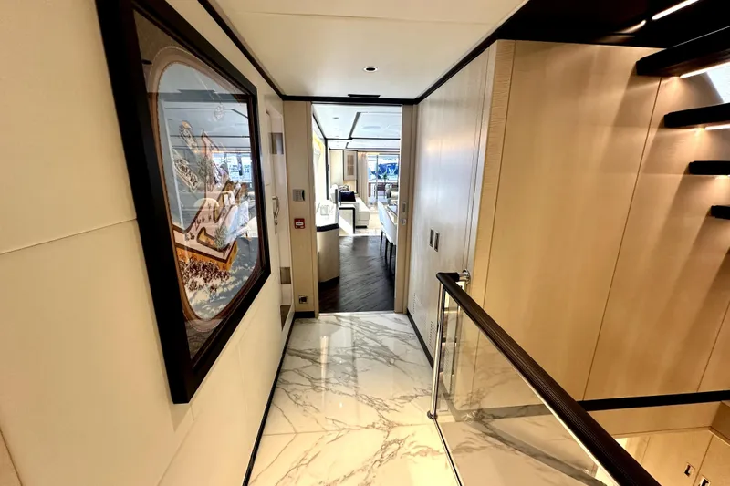 Slide: The Image of Luxurious interior hallway of 2023 Majesty 120 yacht with elegant decor and marble flooring. - 17