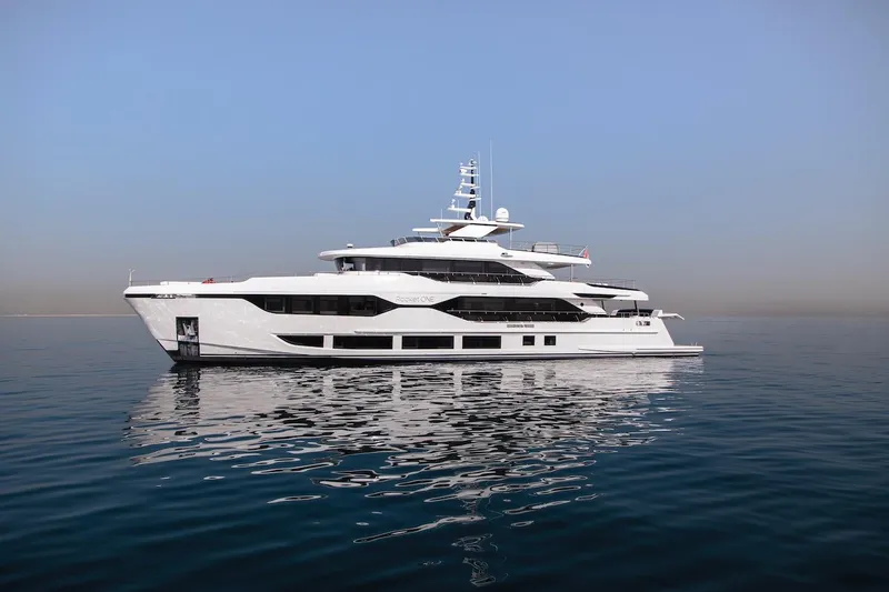 Slide: The Image of Luxurious 2023 Majesty 120 yacht on calm sea under clear blue sky. - 2