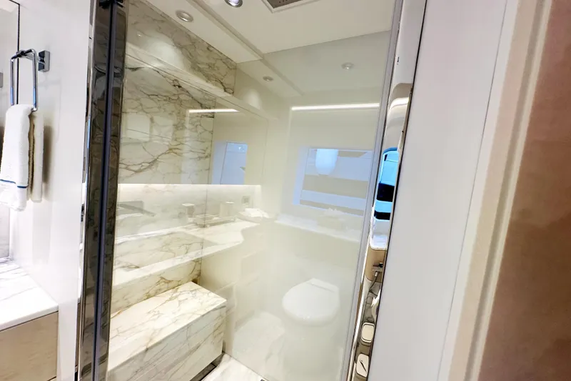 Slide: The Image of Luxurious bathroom with marble accents in 2023 Majesty 120 yacht. - 25