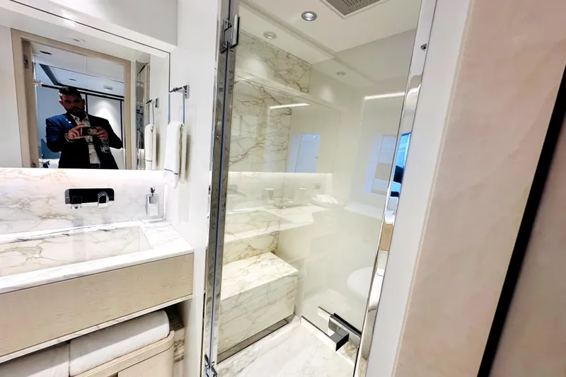 Slide: The Image of Luxurious bathroom in 2023 Majesty 120 yacht with marble accents and modern fixtures. - 26