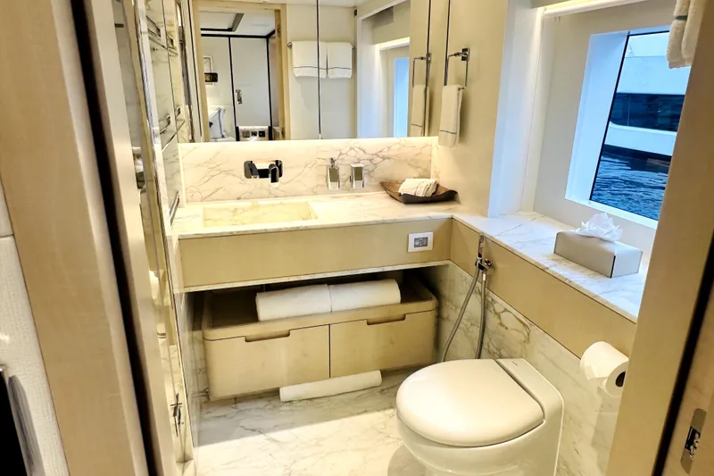 Slide: The Image of Luxurious 2023 Majesty 120 yacht bathroom with marble accents and modern fixtures. - 29