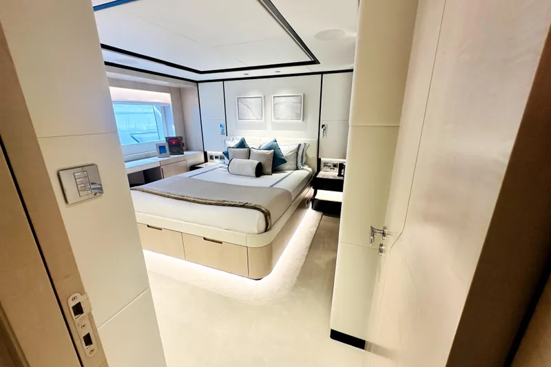 Slide: The Image of Luxurious bedroom interior on 2023 Majesty 120 yacht, featuring modern design and elegant furnishings. - 32