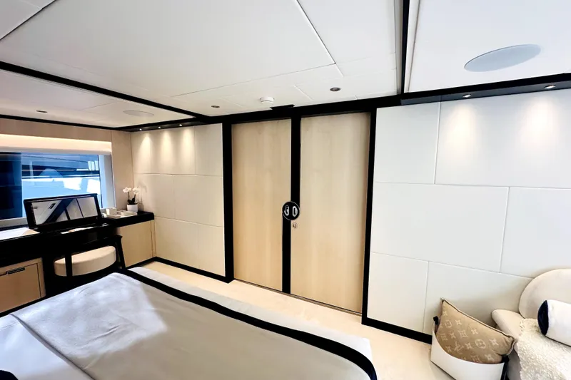 Slide: The Image of Luxurious 2023 Majesty 120 yacht bedroom with modern decor and elegant furnishings. - 45