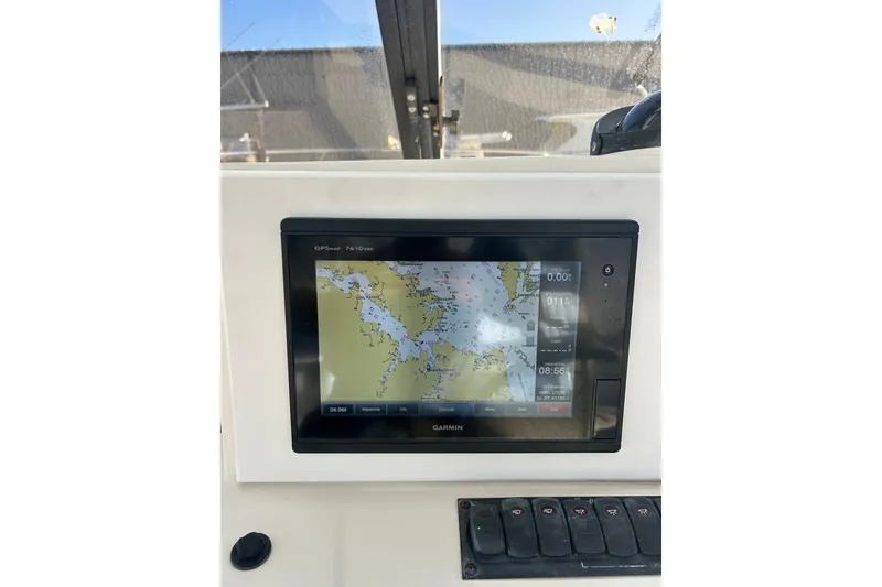 Slide: The Image of Garmin GPS display on 1995 Carolina Classic 28 boat dashboard. - 12