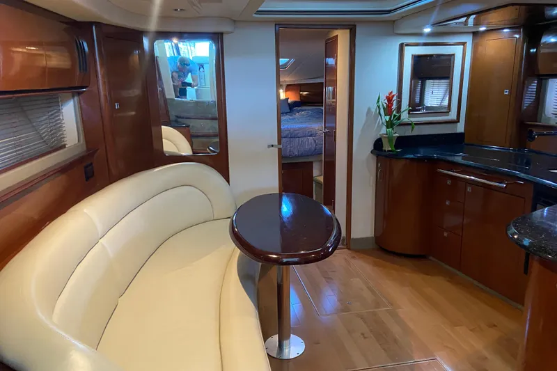 Slide: The Image of Luxurious interior of 2008 Sea Ray 44 Sundancer yacht with elegant seating and modern kitchen. - 10
