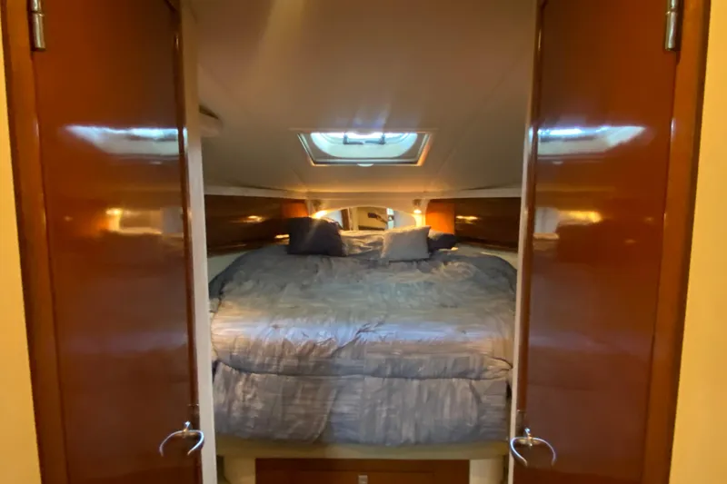 Slide: The Image of Luxurious cabin interior of 2008 Sea Ray 44 Sundancer yacht with cozy bedding. - 13