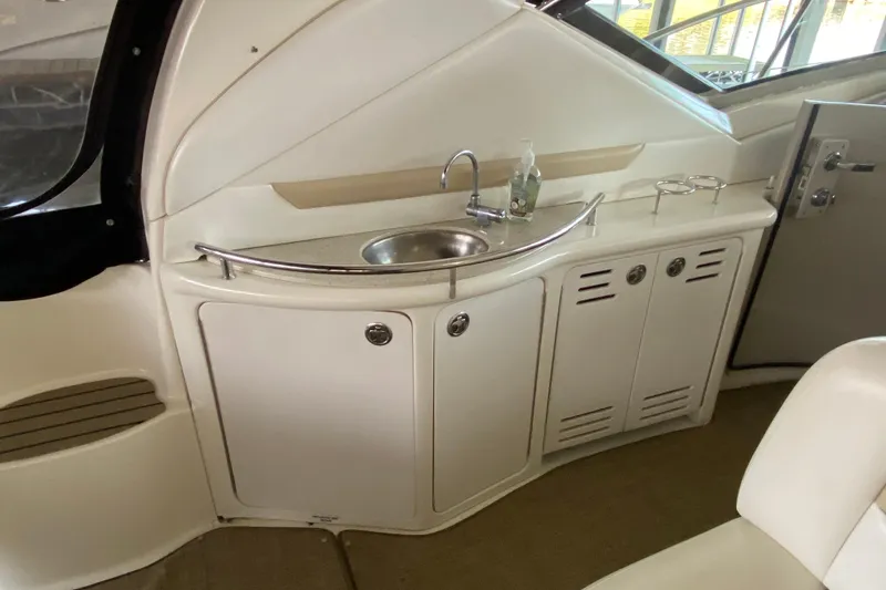 Slide: The Image of 2008 Sea Ray 44 Sundancer yacht interior with sink and storage cabinets. - 8