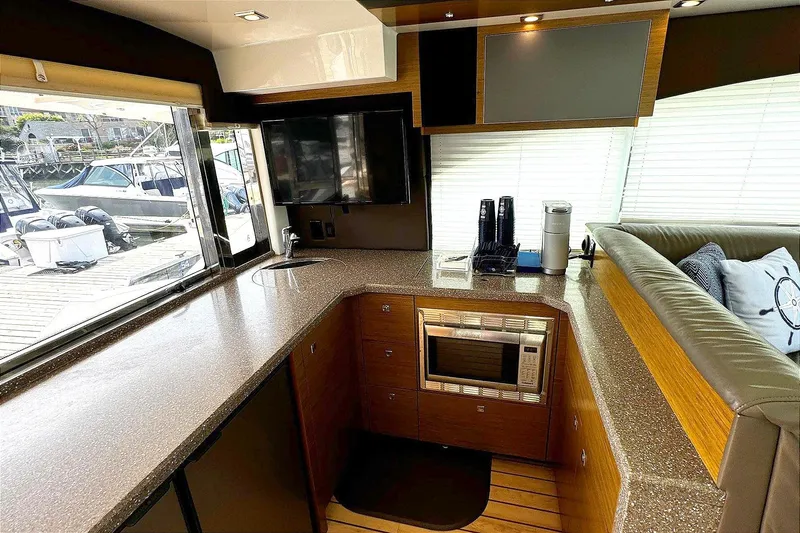 Slide: The Image of Luxurious 2014 Cruisers Yachts 45 Cantius interior with modern kitchen and sleek design. - 10