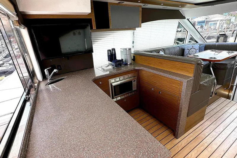 Slide: The Image of Interior of 2014 Cruisers Yachts 45 Cantius with modern kitchen and seating area. - 11