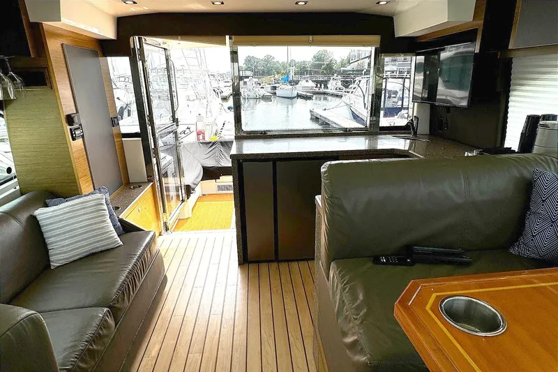 Slide: The Image of Luxurious interior of 2014 Cruisers Yachts 45 Cantius with marina view. - 12