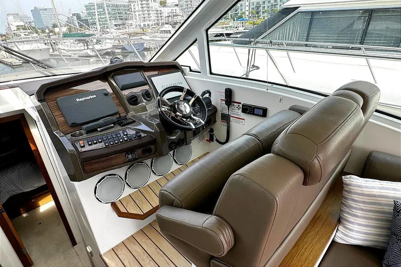 Slide: The Image of 2014 Cruisers Yachts 45 Cantius helm with leather seats and modern controls. - 15