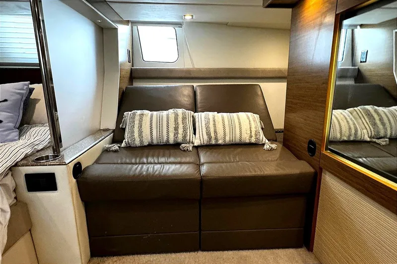 Slide: The Image of Luxurious interior of 2014 Cruisers Yachts 45 Cantius with leather seating and striped cushions. - 17