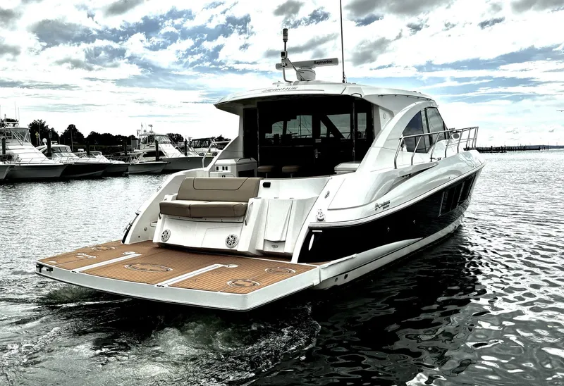 Slide: The Image of 2014 Cruisers Yachts 45 Cantius on water, rear view, sleek design, luxury motor yacht. - 2