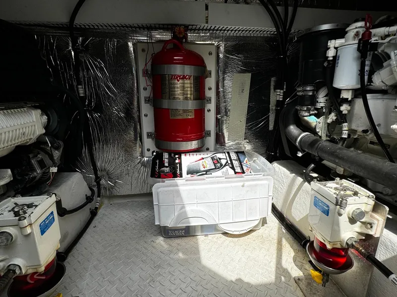 Slide: The Image of Engine room of 2014 Cruisers Yachts 45 Cantius with fire suppression system and equipment. - 23