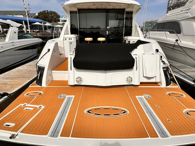Slide: The Image of 2014 Cruisers Yachts 45 Cantius with spacious deck and modern design at marina. - 7