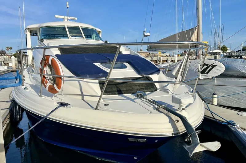 Slide: The Image of 2005 Sea Ray 390 Motor Yacht docked at marina, featuring sleek design and modern amenities. - 2