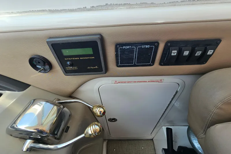 Slide: The Image of Control panel of a 2005 Sea Ray 390 Motor Yacht with system monitor and switches. - 24