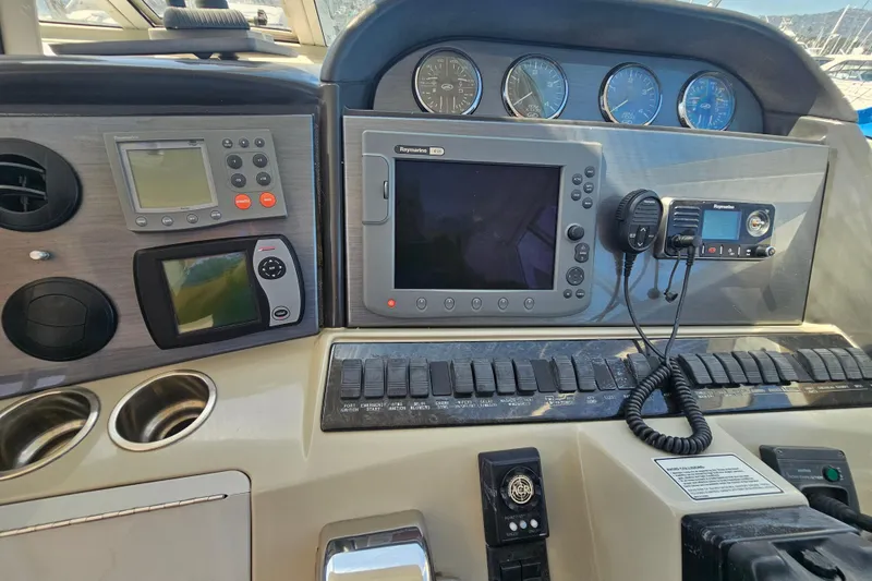 Slide: The Image of Control panel of a 2005 Sea Ray 390 Motor Yacht with navigation instruments. - 25