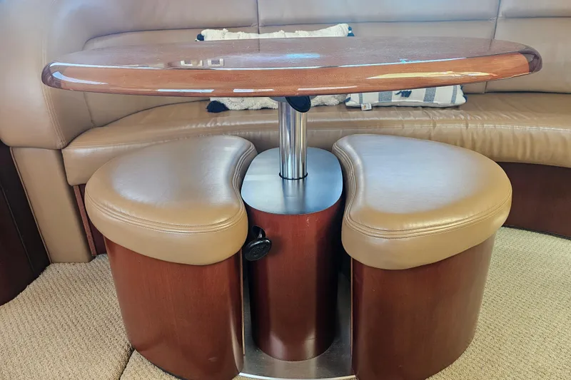 Slide: The Image of Interior of 2005 Sea Ray 390 Motor Yacht with elegant seating and table. - 30