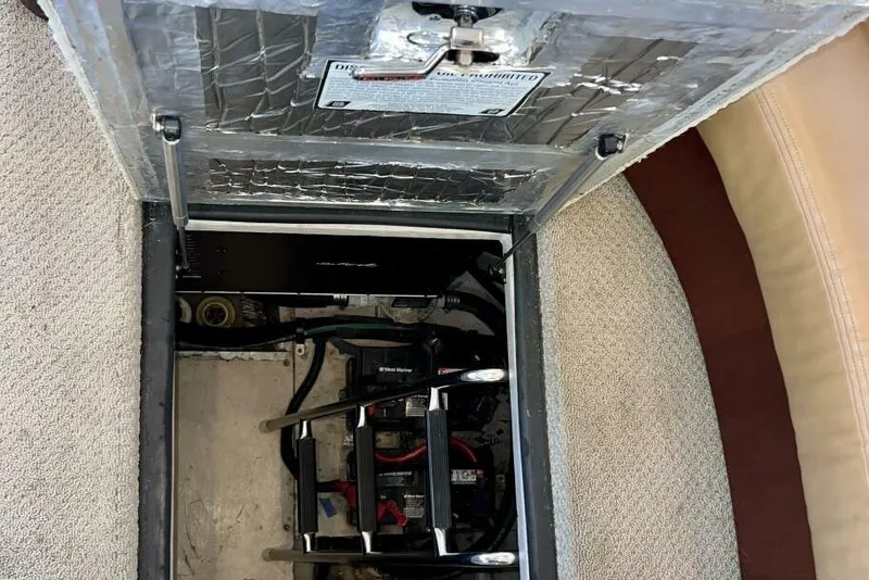 Slide: The Image of 2005 Sea Ray 390 Motor Yacht engine compartment with visible battery and wiring. - 46