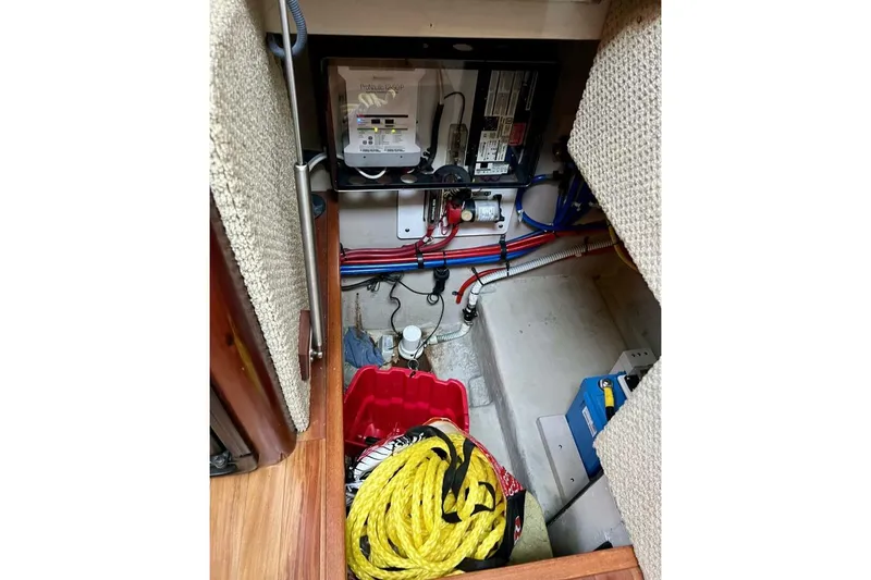 Slide: The Image of 2005 Sea Ray 390 Motor Yacht interior storage with ropes and electrical panel. - 47