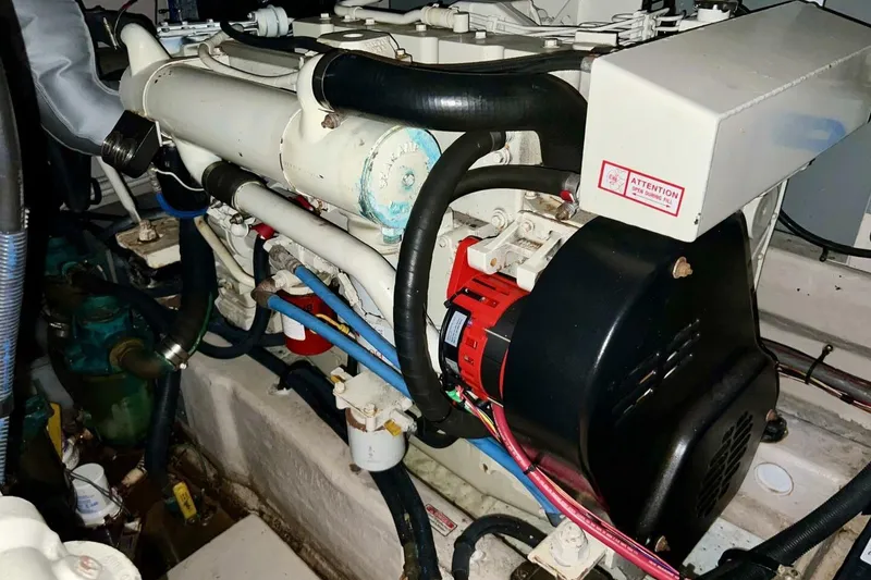 Slide: The Image of Engine room of 2005 Sea Ray 390 Motor Yacht with visible components and wiring. - 48