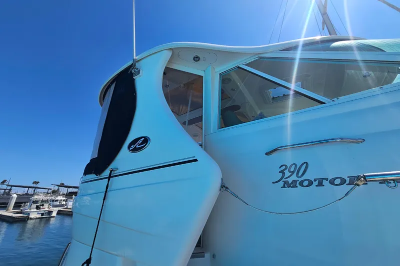 Slide: The Image of 2005 Sea Ray 390 Motor Yacht docked under clear blue sky. - 8