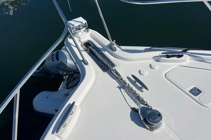 Slide: The Image of 2014 Tiara Yachts 3900 Coronet bow with anchor chain and Honda outboard motor. - 14