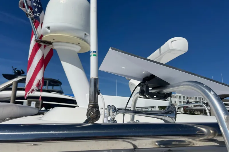 Slide: The Image of 2014 Tiara Yachts 3900 Coronet with American flag and radar equipment on deck. - 30