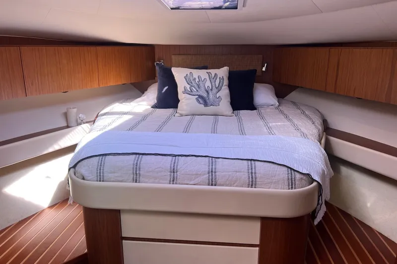 Slide: The Image of Luxurious cabin interior of 2014 Tiara Yachts 3900 Coronet with cozy bedding. - 32