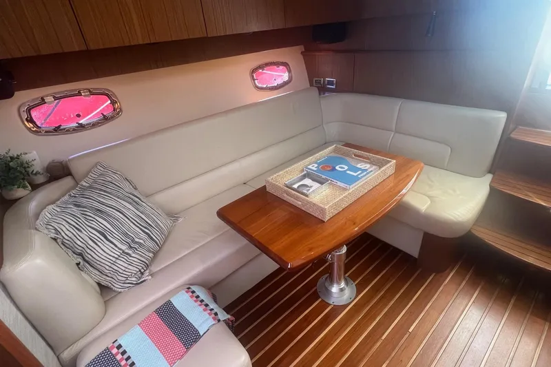 Slide: The Image of Luxurious interior of 2014 Tiara Yachts 3900 Coronet with elegant seating and wooden table. - 41