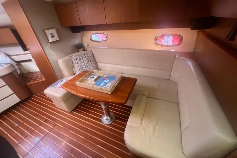 Slide: The Image of Luxurious interior of 2014 Tiara Yachts 3900 Coronet with elegant seating and wooden accents. - 42