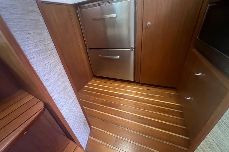 Slide: The Image of Wood-paneled yacht interior with stainless steel fridge, Tiara Yachts 3900 Coronet, 2014 model. - 44