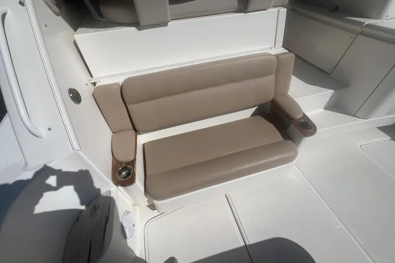 Slide: The Image of 2014 Tiara Yachts 3900 Coronet interior seating with cup holders, beige upholstery. - 51