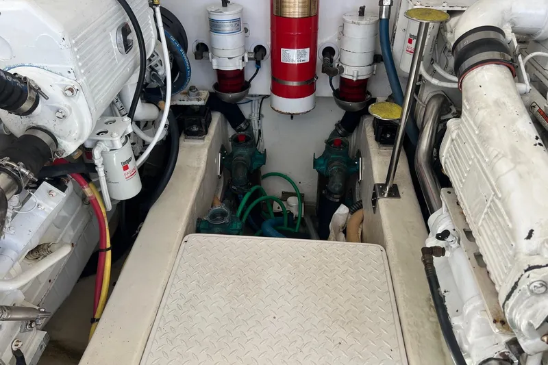 Slide: The Image of Engine room of 2014 Tiara Yachts 3900 Coronet, showcasing mechanical components and systems. - 56