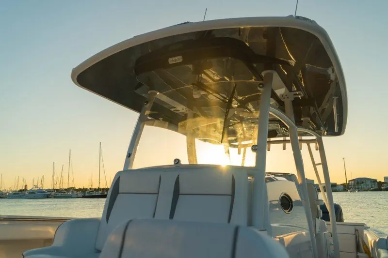 Slide: The Image of 2026 Southport 33 FE boat at sunset, showcasing sleek design and modern features. - 13