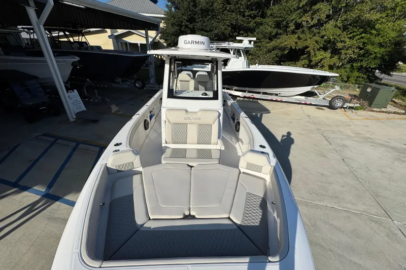 Slide: The Image of 2026 Solace 28 HCS boat with Garmin equipment, docked in a marina. - 23