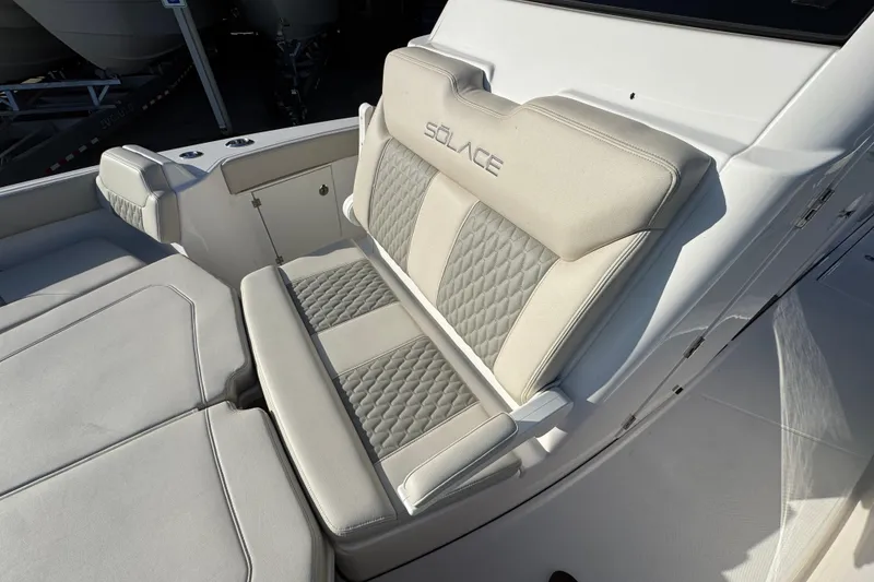 Slide: The Image of Luxurious seating on 2026 Solace 28 HCS boat with quilted upholstery. - 25