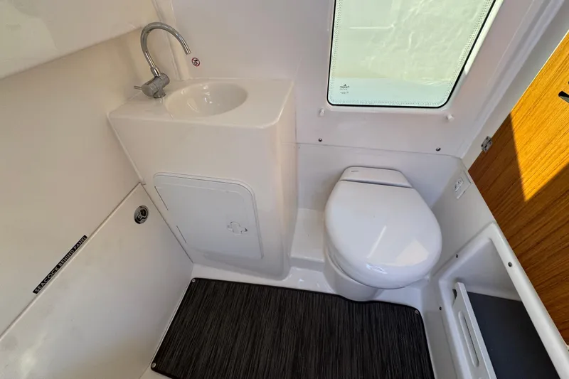 Slide: The Image of Compact bathroom in 2026 Solace 28 HCS boat with sink and toilet. - 29
