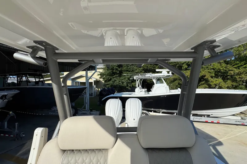 Slide: The Image of Interior view of a 2026 Solace 28 HCS boat with seating and canopy. - 33