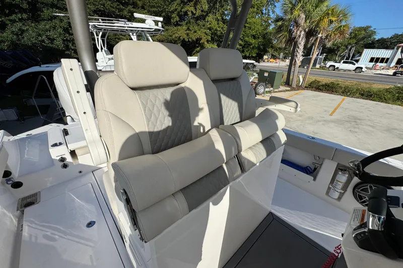 Slide: The Image of Luxurious seating on 2026 Solace 28 HCS boat, featuring plush, diamond-stitched upholstery. - 38