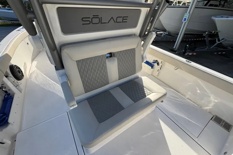 Slide: The Image of 2026 Solace 28 HCS boat interior with cushioned seating and sleek design. - 39